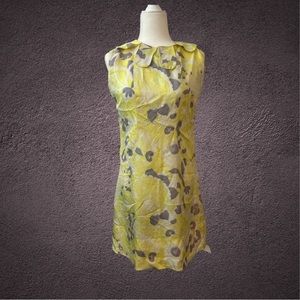 Vintage yellow flower motif dress. Fits like an 8. Silky polyester.
